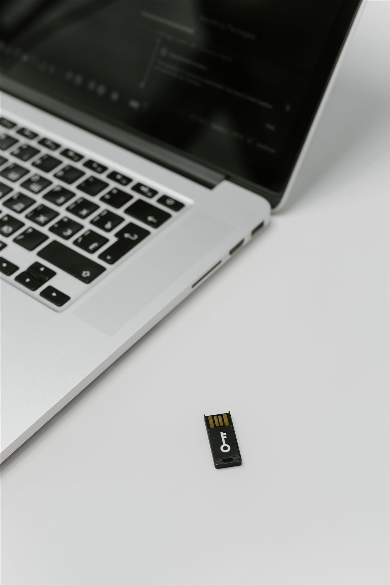 USB security key beside a laptop